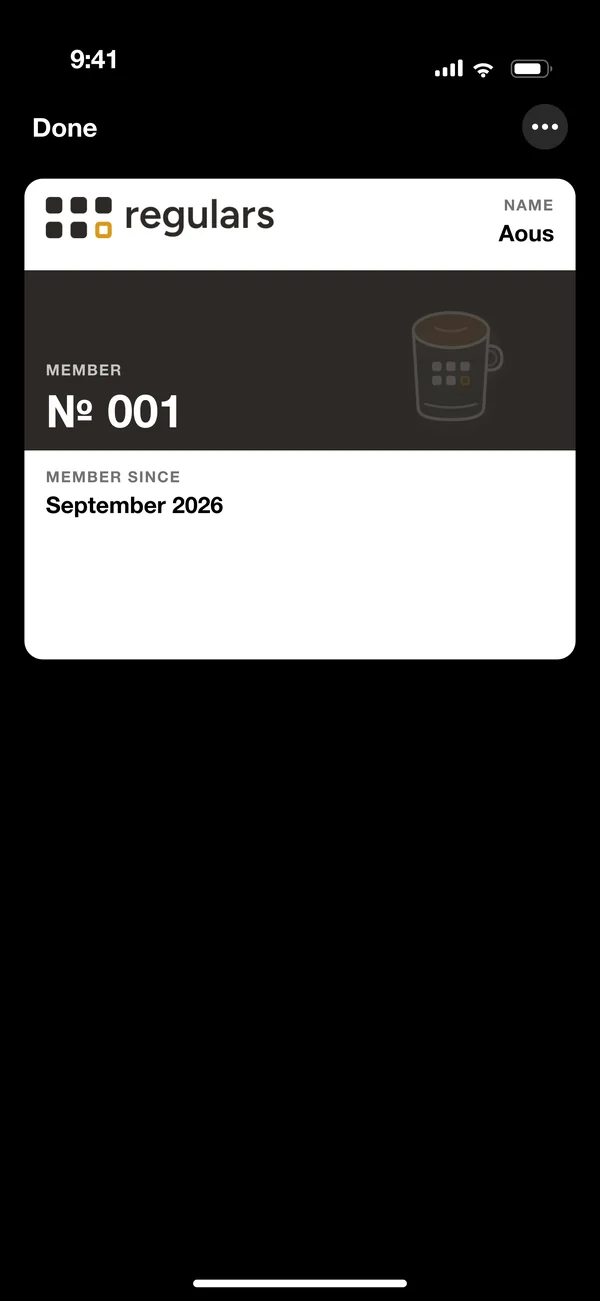 The same café's membership card in Apple Wallet: member number 001, member since September 2026.